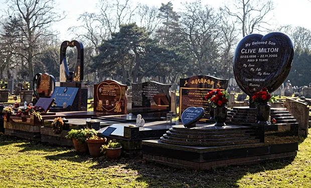 Polished marble and granite grave monuments on Southgate Road in the City of London Cemetery, Aldersbrook Road, Newham